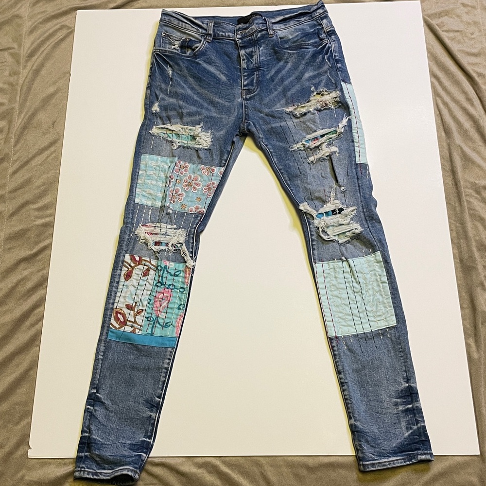 AMIRI Blue Distressed Jeans with Patches. Size 31.